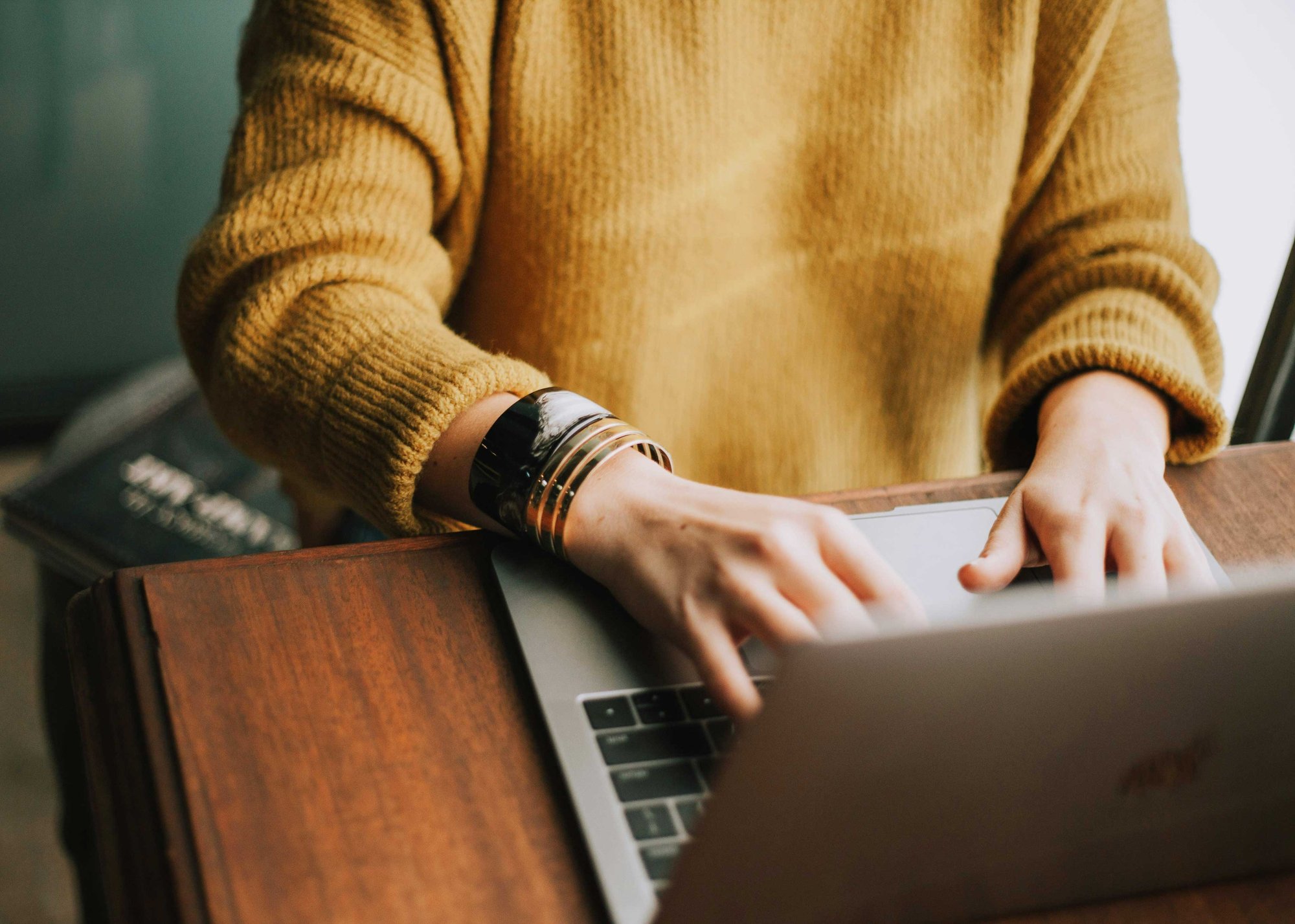 Person working on a laptop, illustrating secure and private data handling
