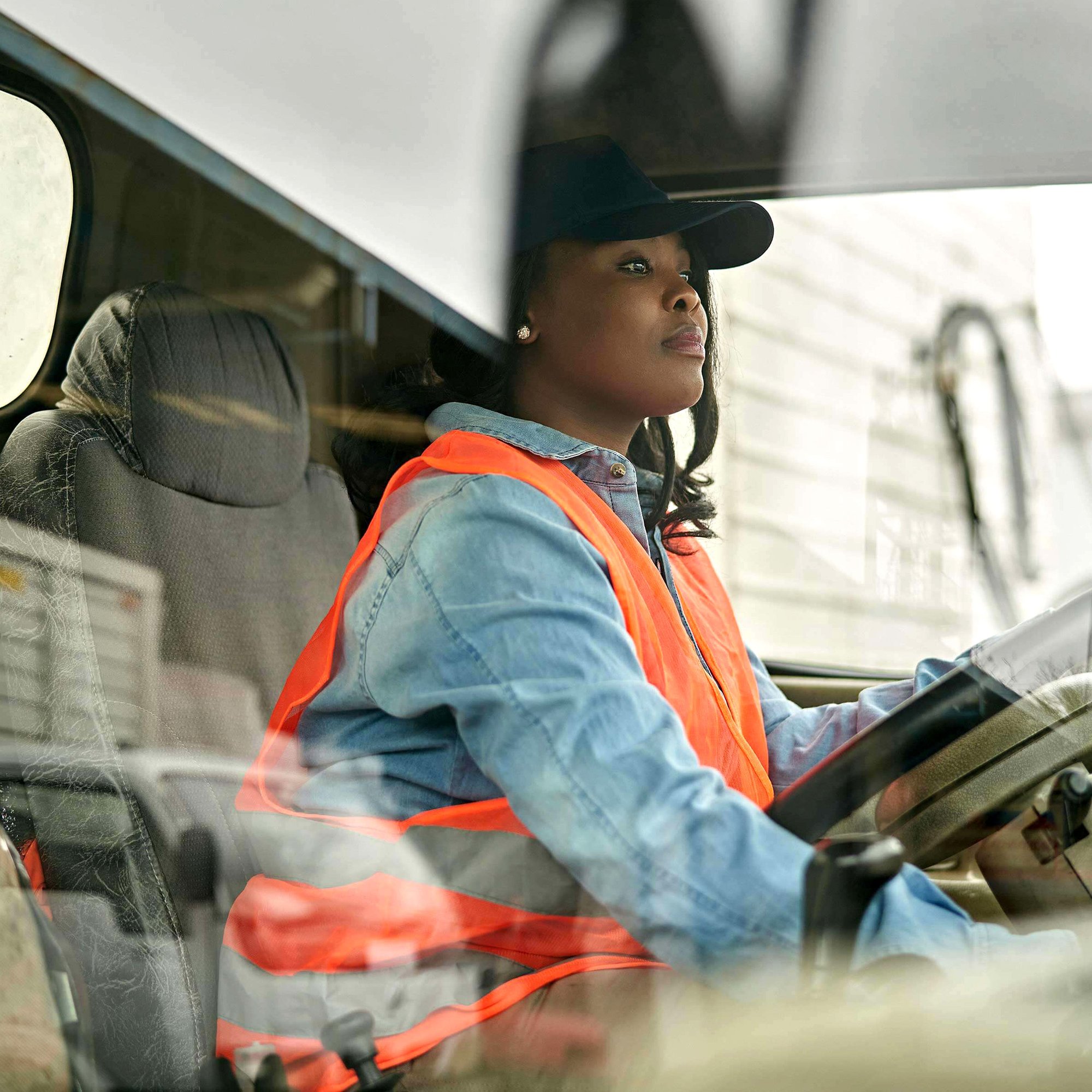 POC woman driving a vehicle