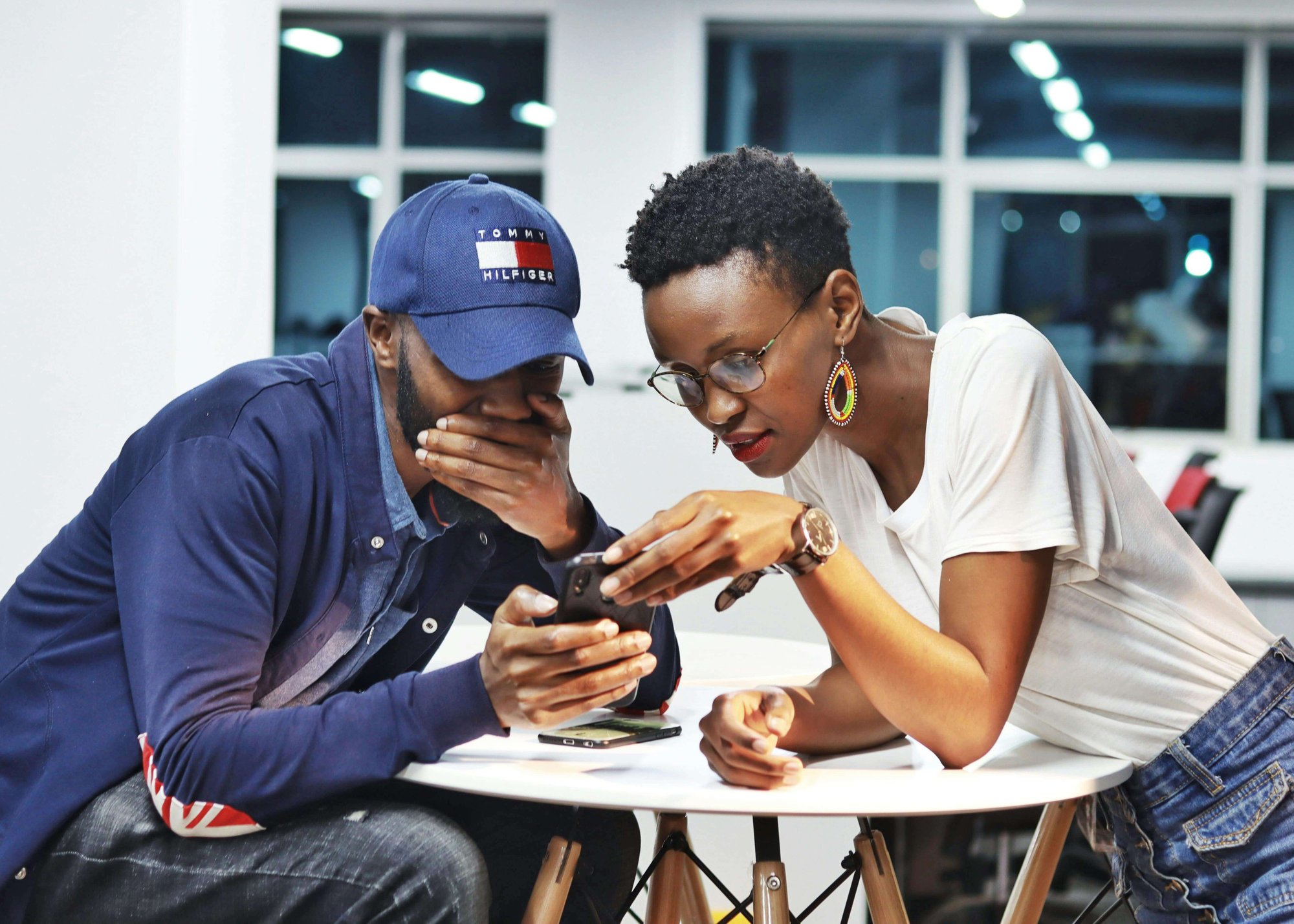 Two employees using the Peppy app to explore health support services